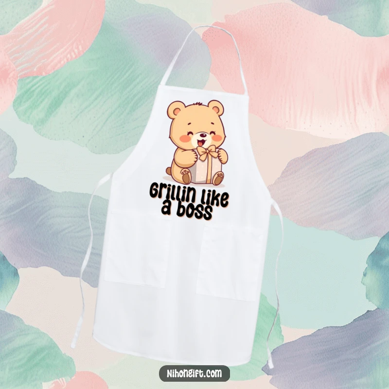 Funny bear apron showing a little bear enthusiastically opening a wrapped gift, great for kitchens and humorous gifts.
