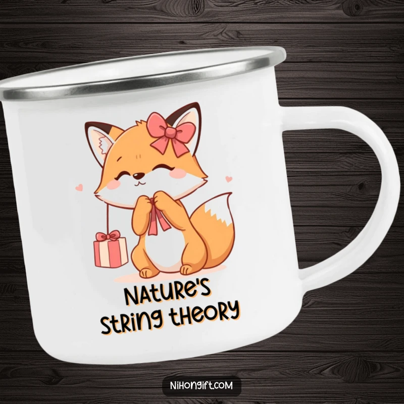 Funny Kawaii Fox Camping Mug showing a cute fox playfully batting at a dangling gift ribbon, ready for outdoor fun and smiles.