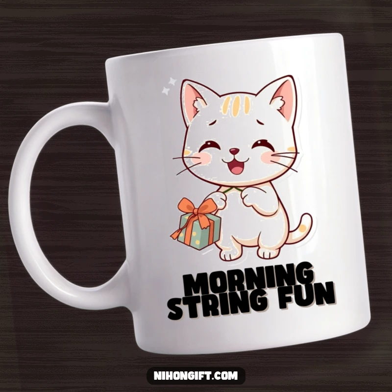 Funny smiling cat character happily dangling a string from a gift box on this mug, looking mischievous.