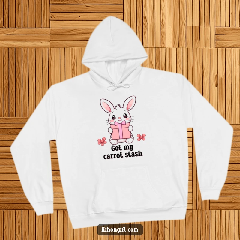 Funny bunny hoodie showing a cute bunny with wide eyes ready to open a big gift box, a humorous and cozy item.