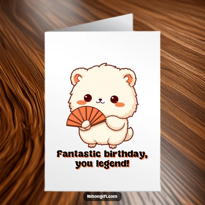 Funny Free Printable Birthday Card: Fluffy animal gracefully presents a Japanese fan, radiating a joyful birthday vibe.