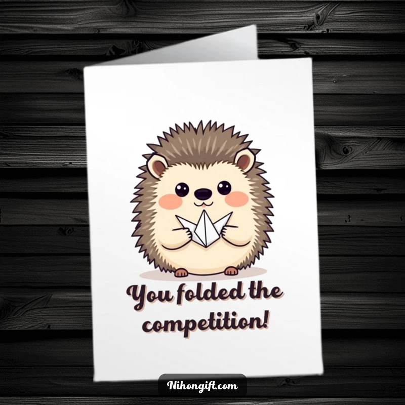 Free Printable Congratulations Card: A hedgehog proudly presents a tiny origami crane, celebrating achievement.