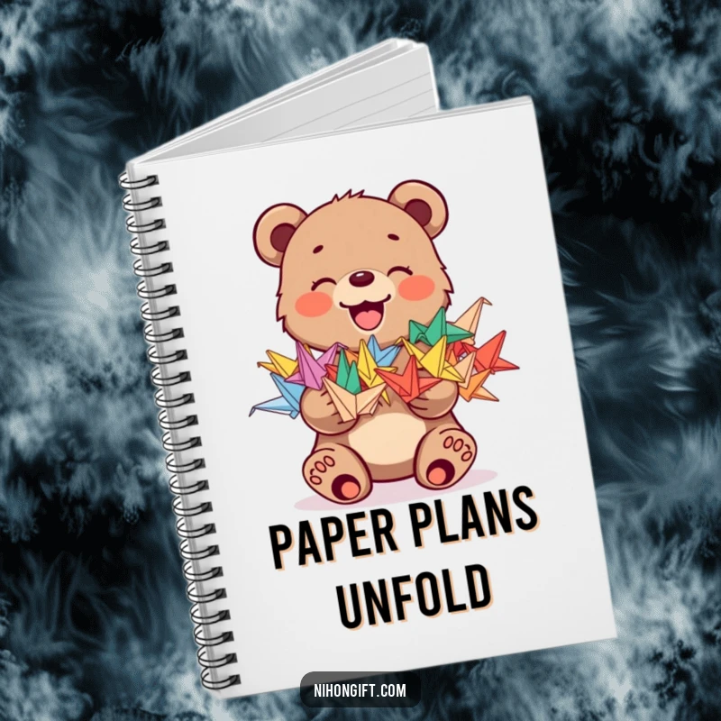 Funny notebook featuring a joyful bear cub holding a stack of colorful origami cranes, inspiring creativity and humor.