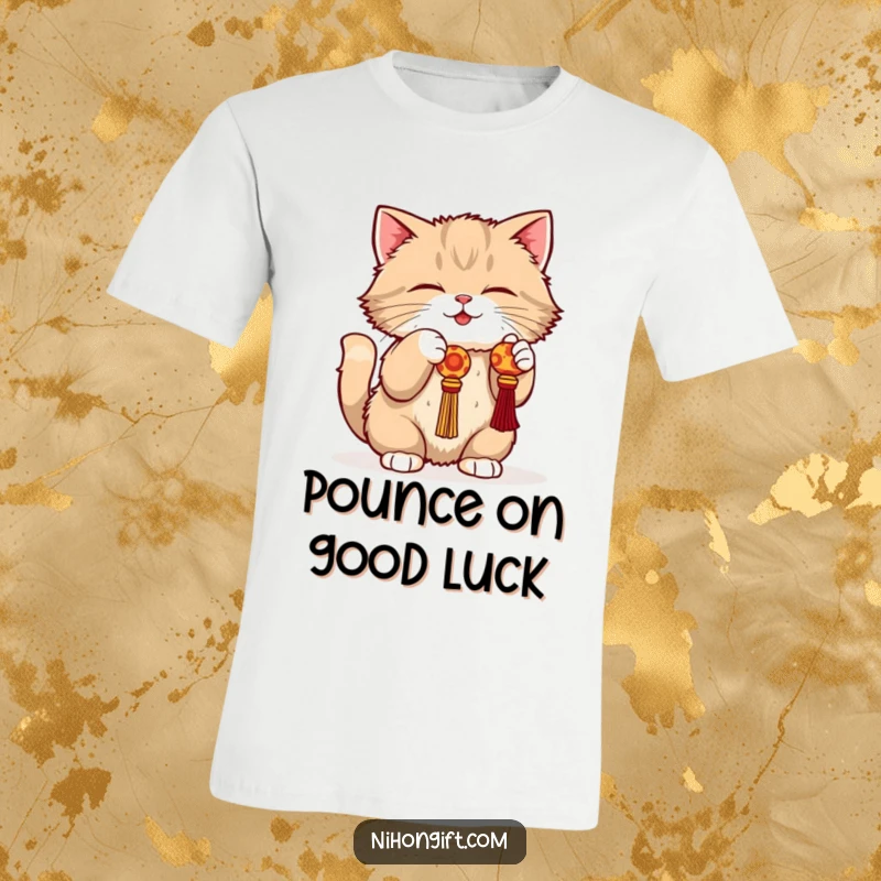 Funny cat t-shirt featuring a fluffy cat in a playful crouch, batting enthusiastically at a dangling lucky charm.