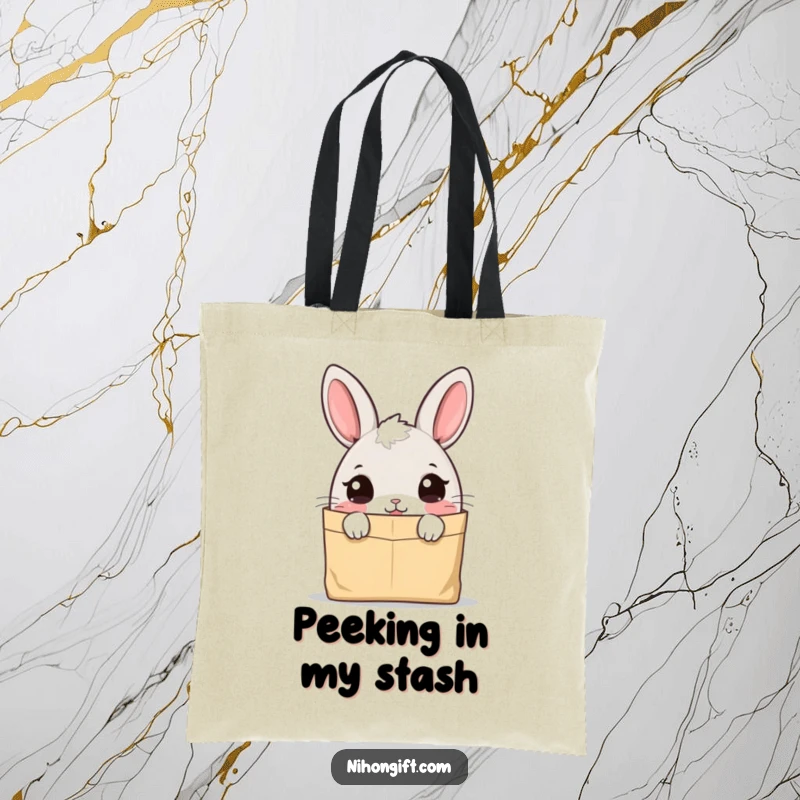 Funny bunny tote bag featuring a cute character peeking curiously into a paper bag, adding playful charm.