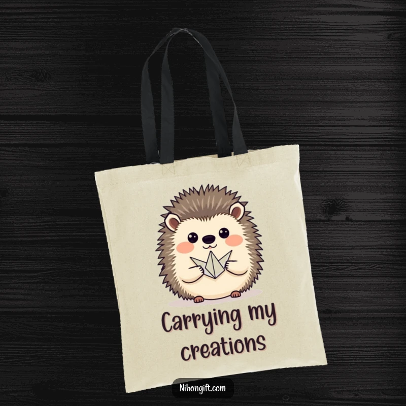 Funny hedgehog proudly presenting a tiny origami crane, on a durable tote bag for shopping and art supplies.